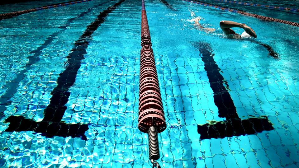 Swimmer in a lane of a swimming pool