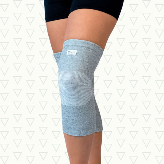 Gray bamboo knee sleeve worn on the knee, front view